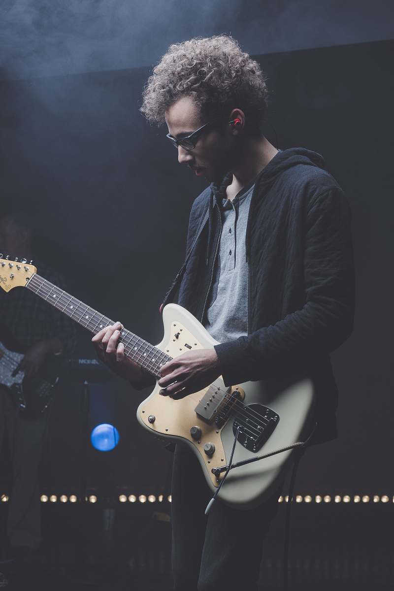 person man playing with electric guitar human