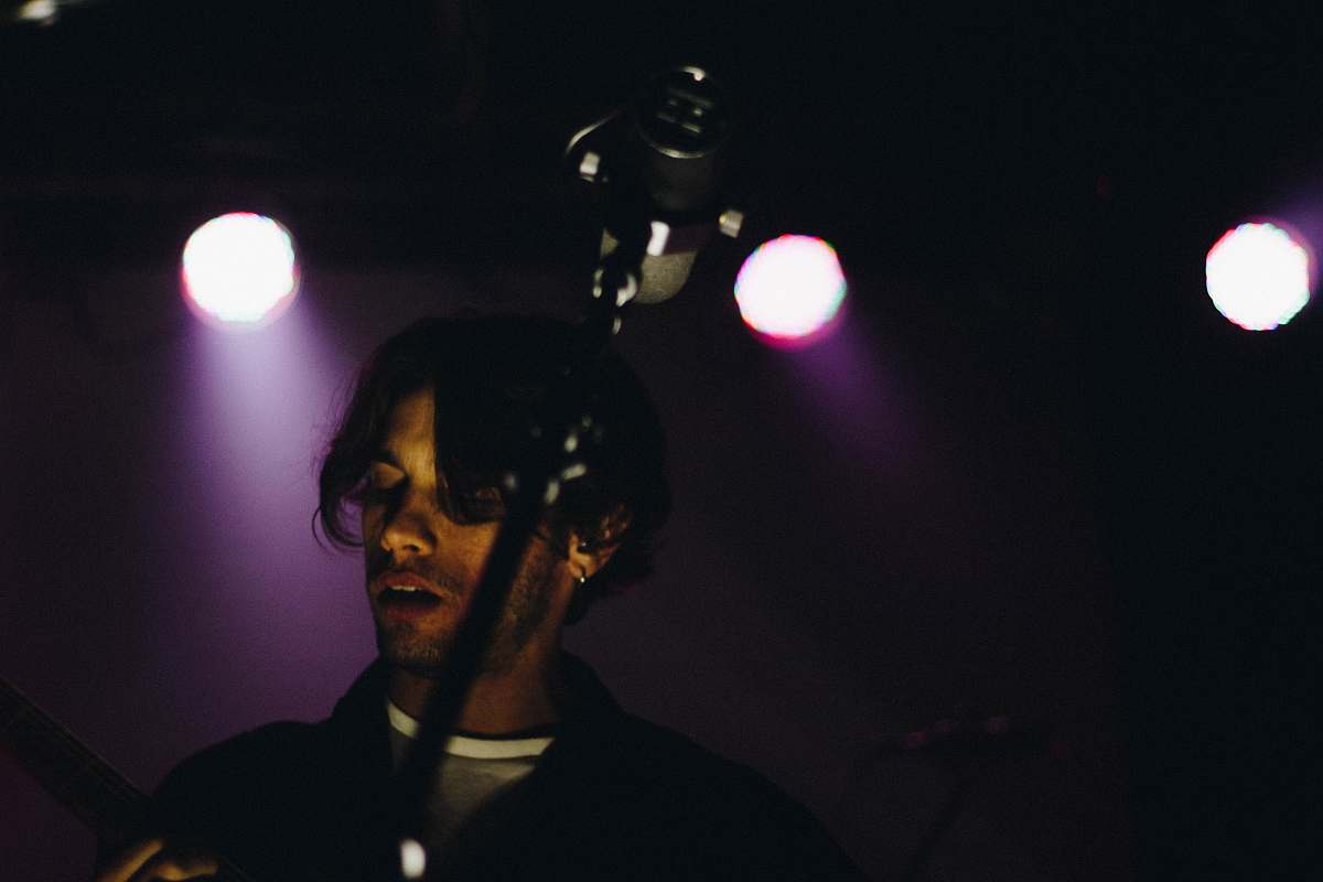 man man standing in front of microphone singer