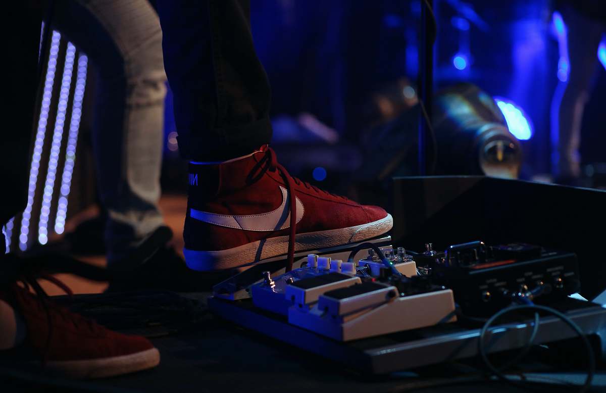 lighting man stepping on pedal effects electronics