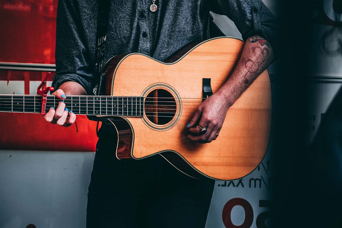 person man using guitar human