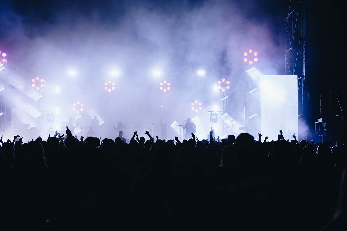 crowd people watching live band during night time israel