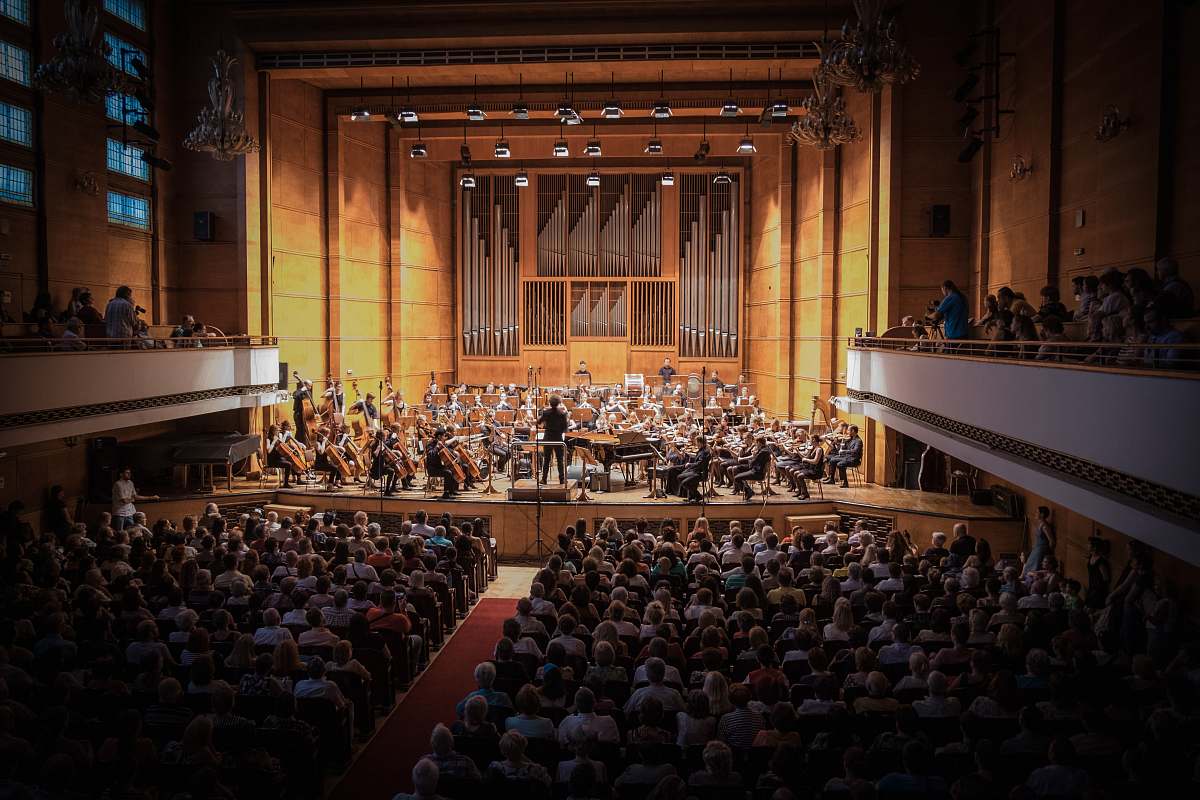 audience people watching orchestra concert