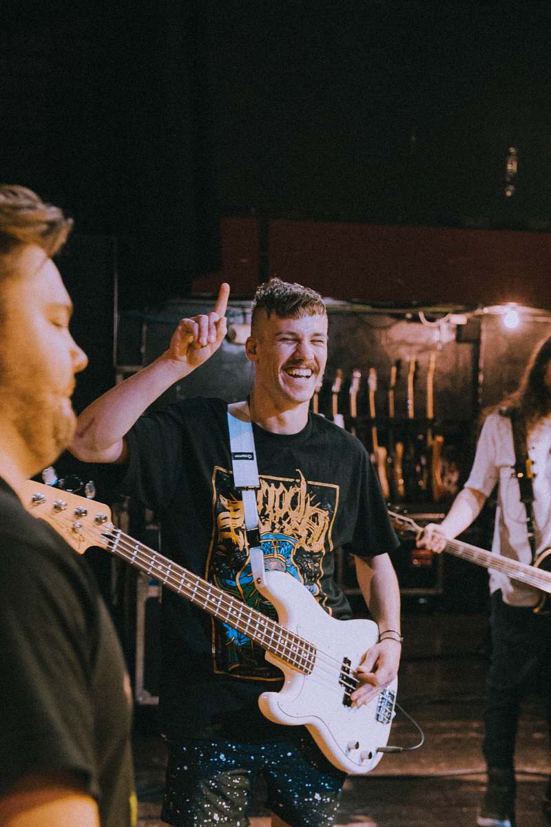 guitar person holding Fender precision bass human