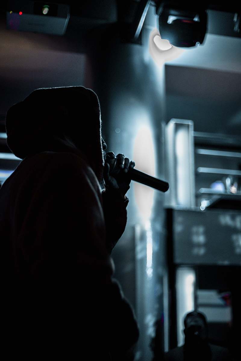 person person in standing position while holding microphone human