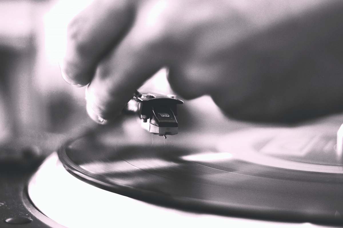 grey person playing vinyl record vinyl