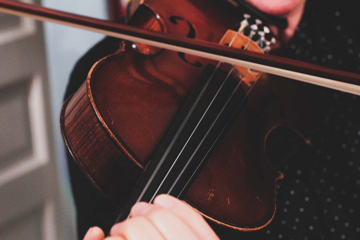 cello person playing violin leisure activities