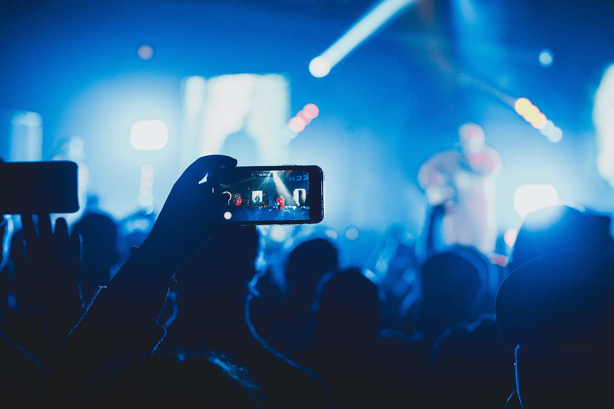 concert person taking picture on stage the belasco theater