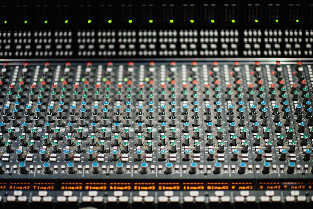 mixer selective focus photography of black and red audio mixer grey