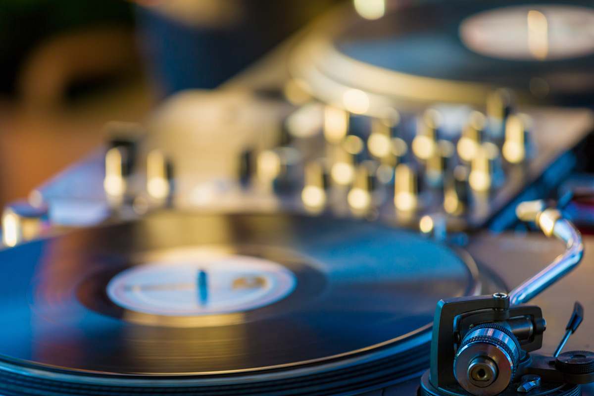 turntable selective focus photography of black vinyl player record player