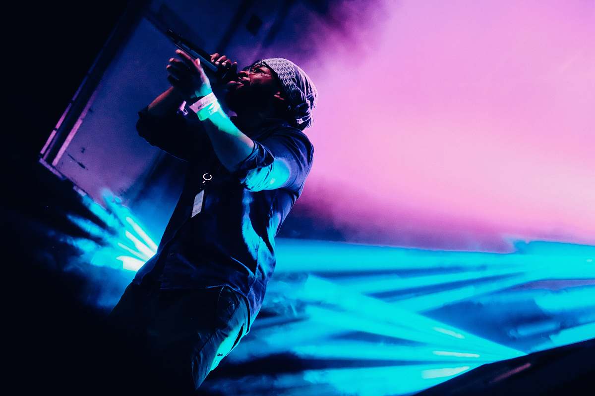 human man holding wireless microphone person