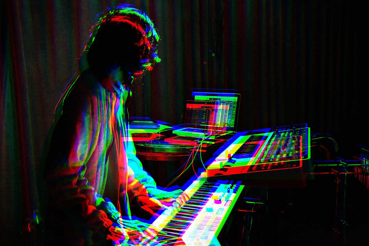 human man playing electronic keyboard person
