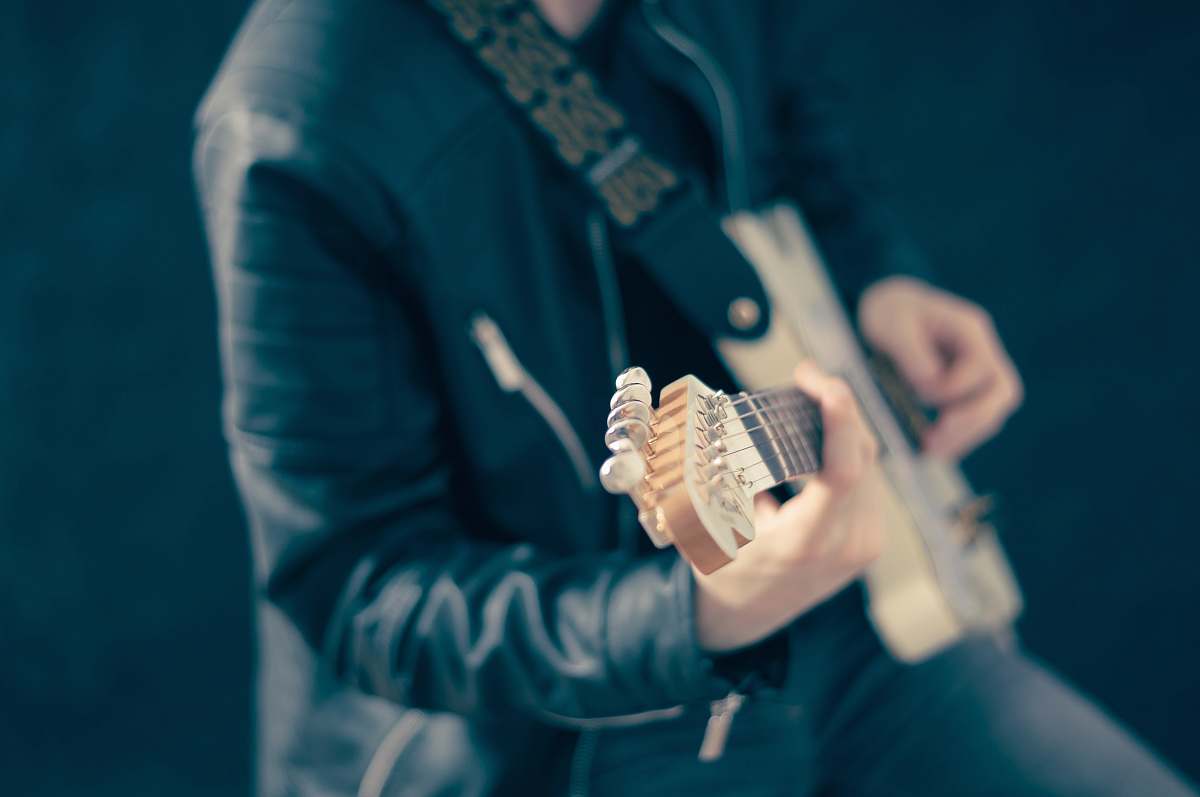 human man playing guitar person