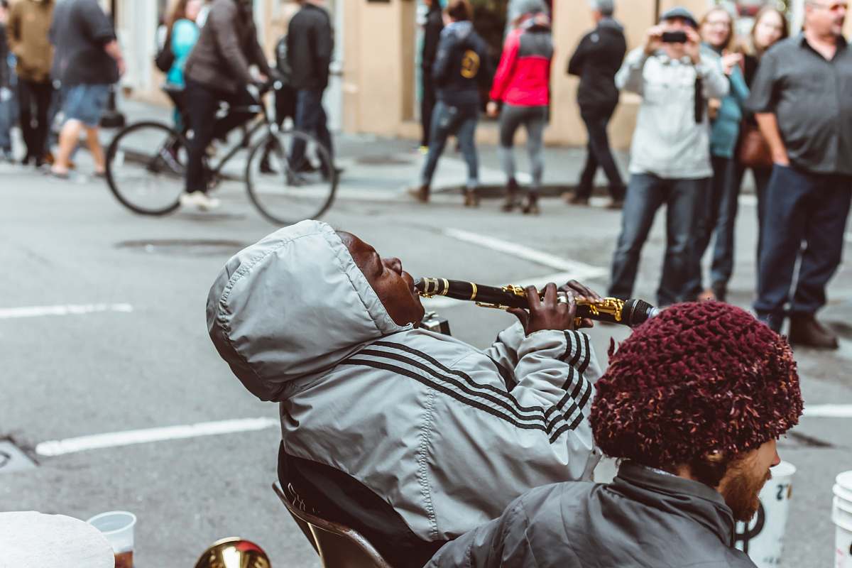 bike man sitting on chair playing flute person