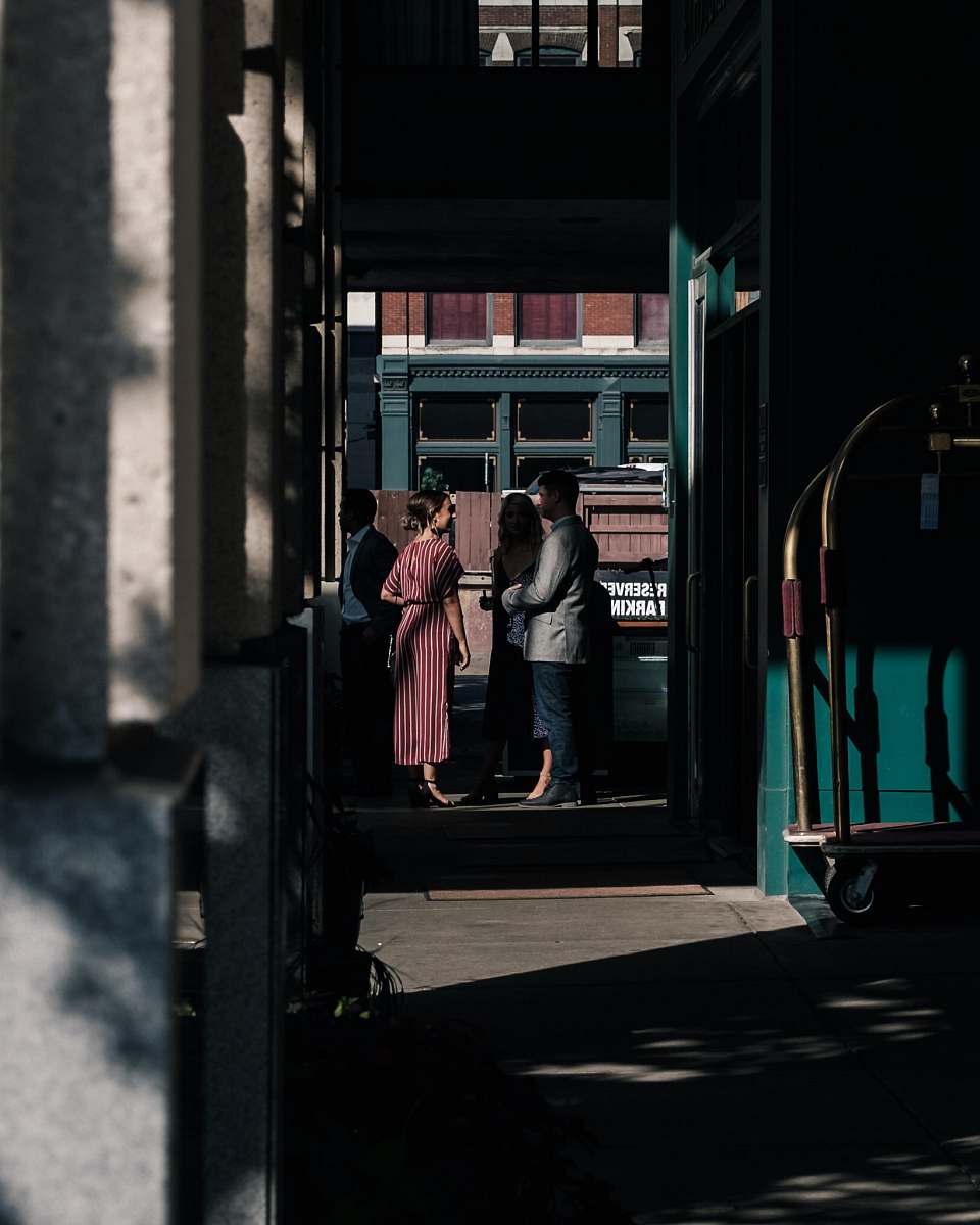 human man standing in front of woman person