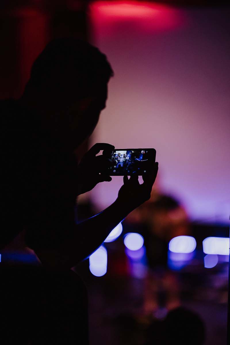 human person holding smartphone with turned-on screen person