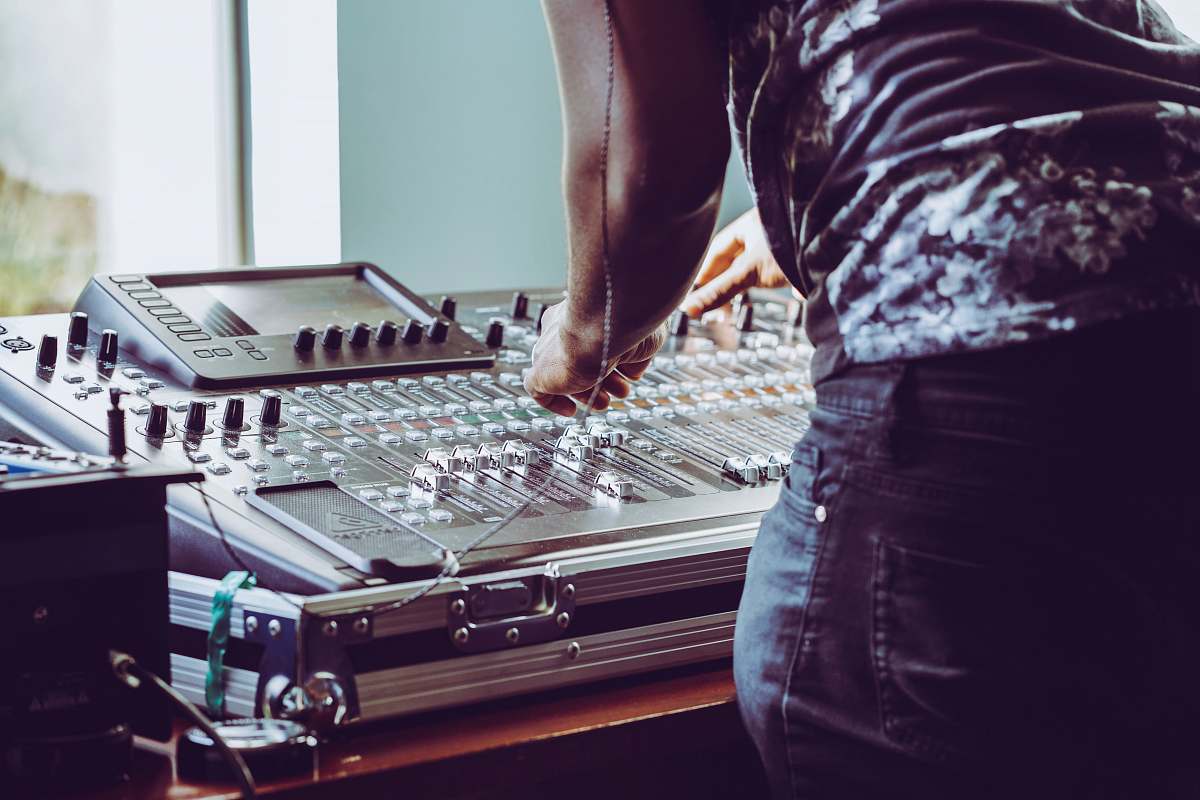 person photo of person adjusting audio mixer human