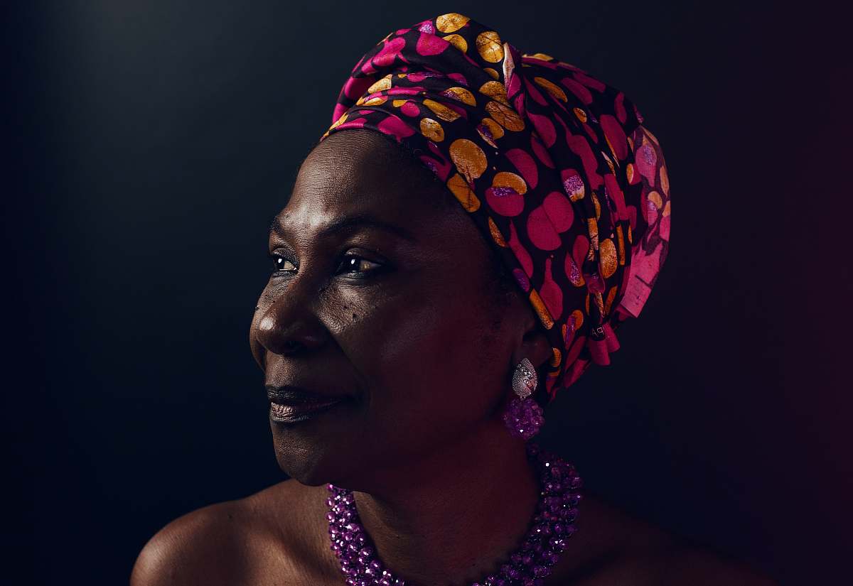 human woman wearing black and multicolored turband woman