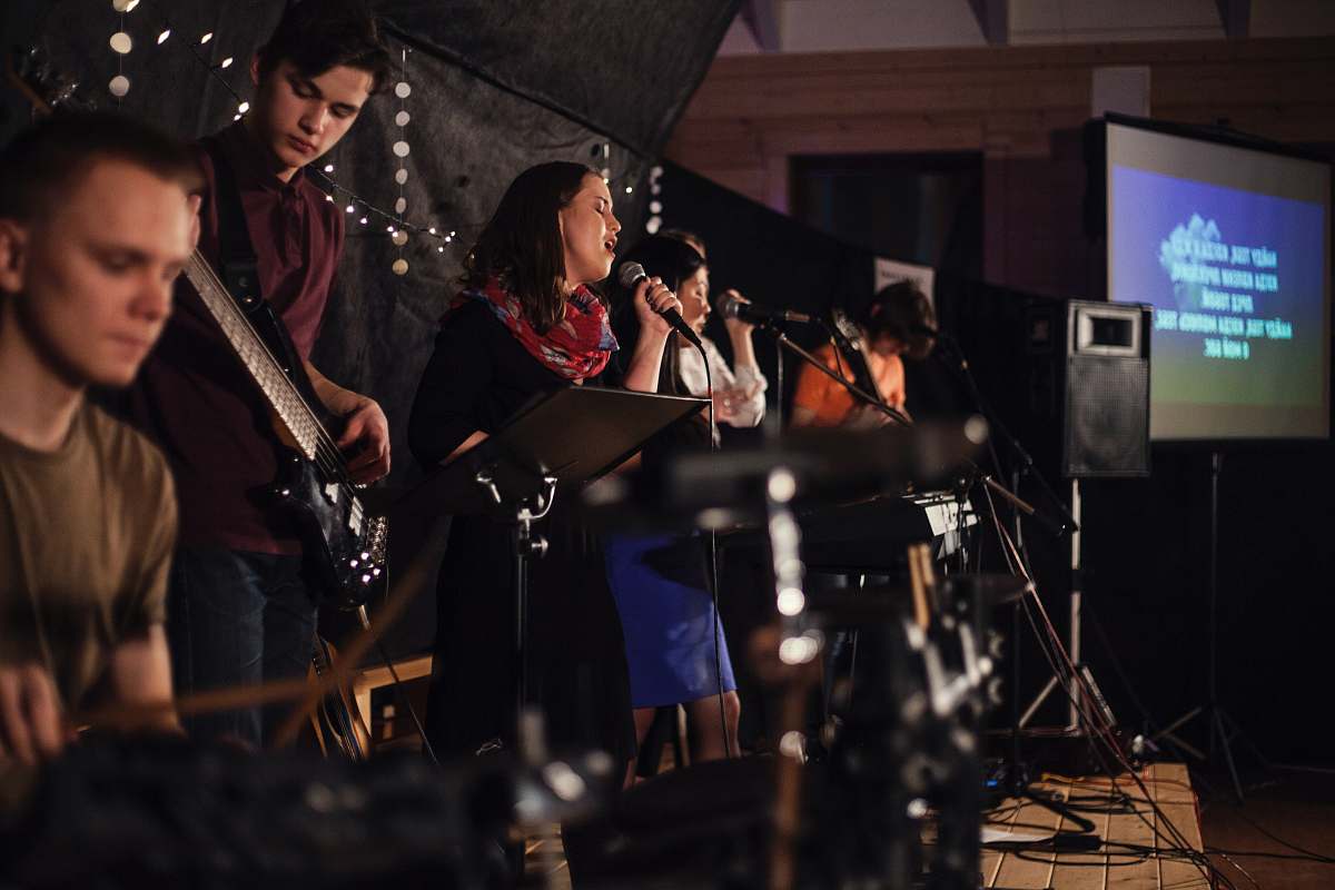 human band performing on stage people