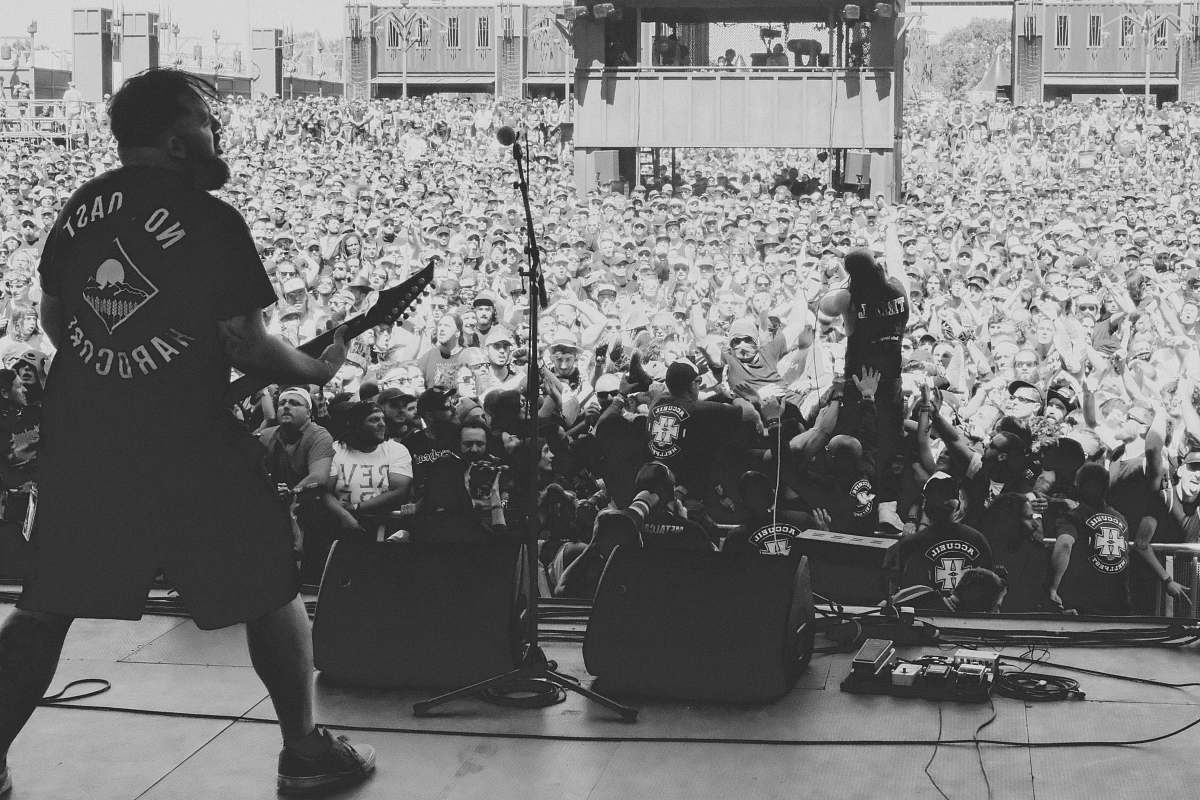 human band playing on stage black-and-white
