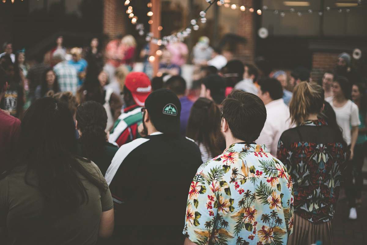 Human Group Of People Standing Under String Lights People Image Free Photo