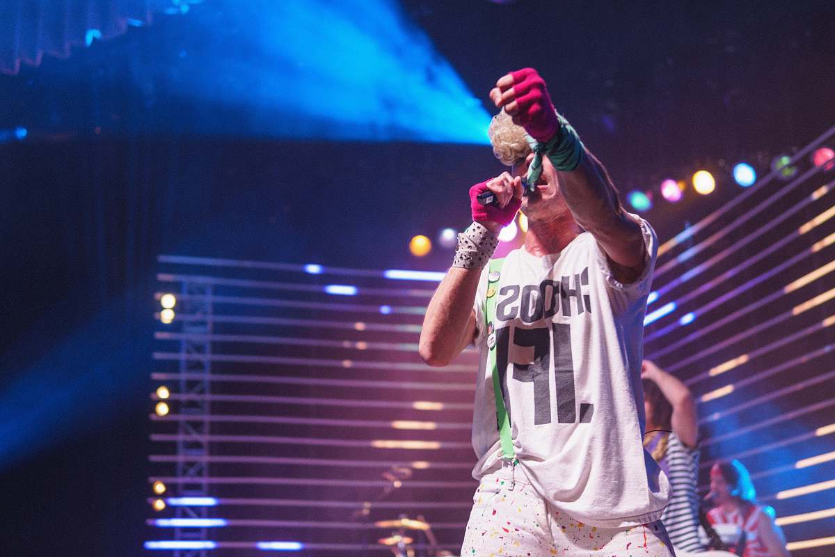 human man holding microphone and bumpfist gesture people