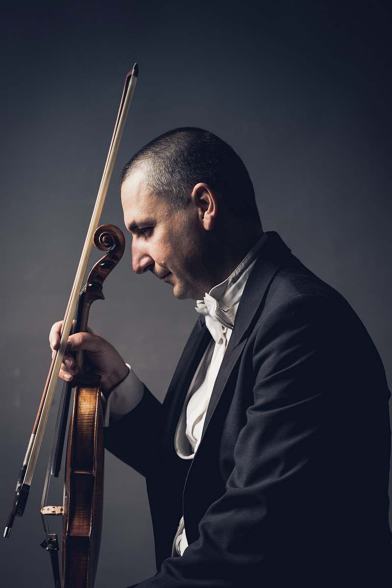 human man holding violin and bow people