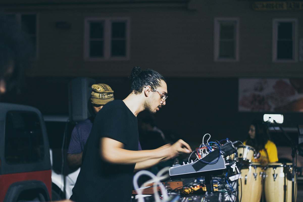 human man operating gray audio equalizer people