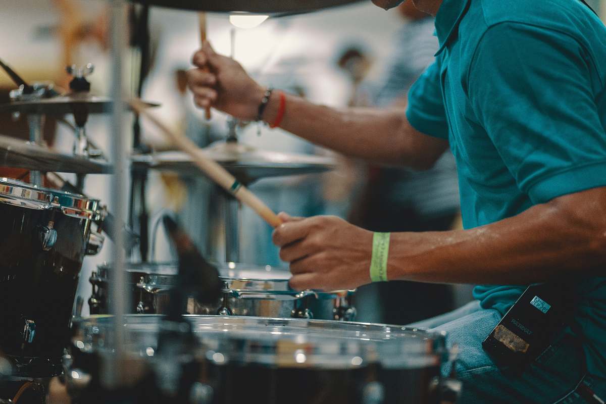 human man playing acoustic drum people