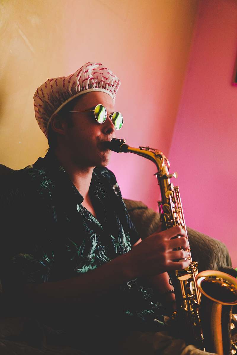human man playing saxophone saxophone