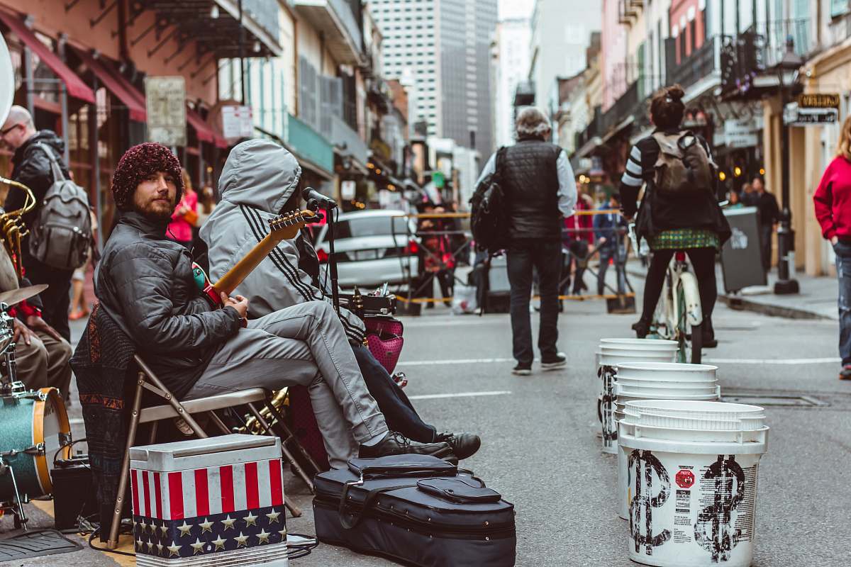 human people at the streets near a live band people