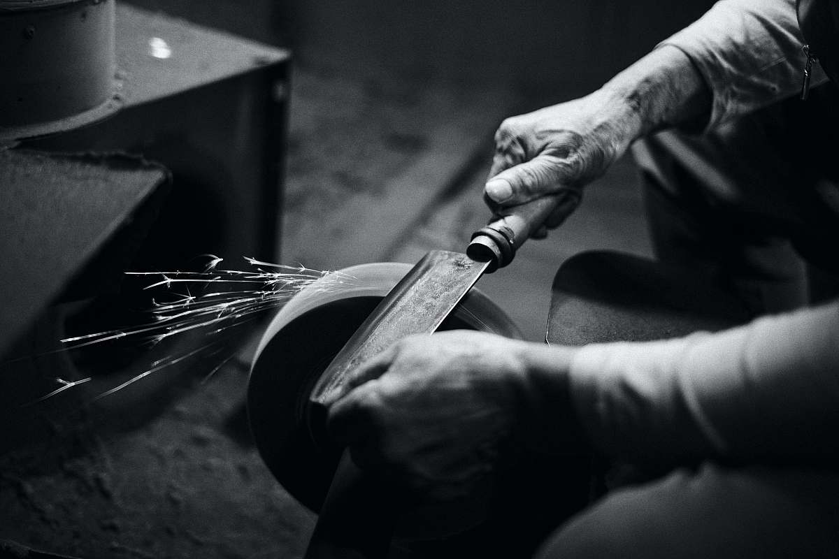 human person grinding cleaver black-and-white
