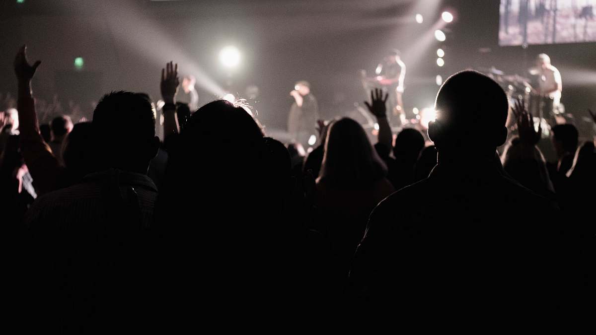 human silhouette of crowd watching live band concert crowd