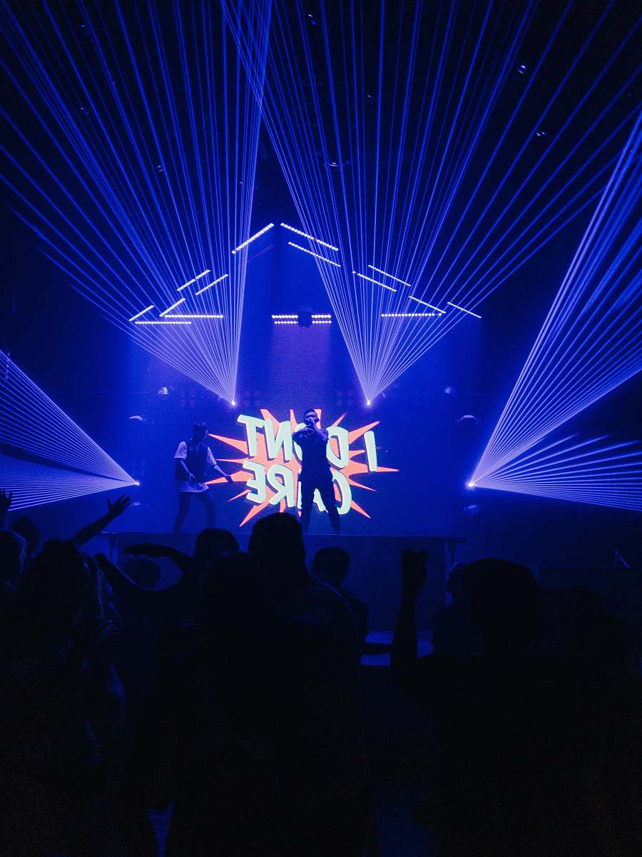 human silhouette of people standing on stage club
