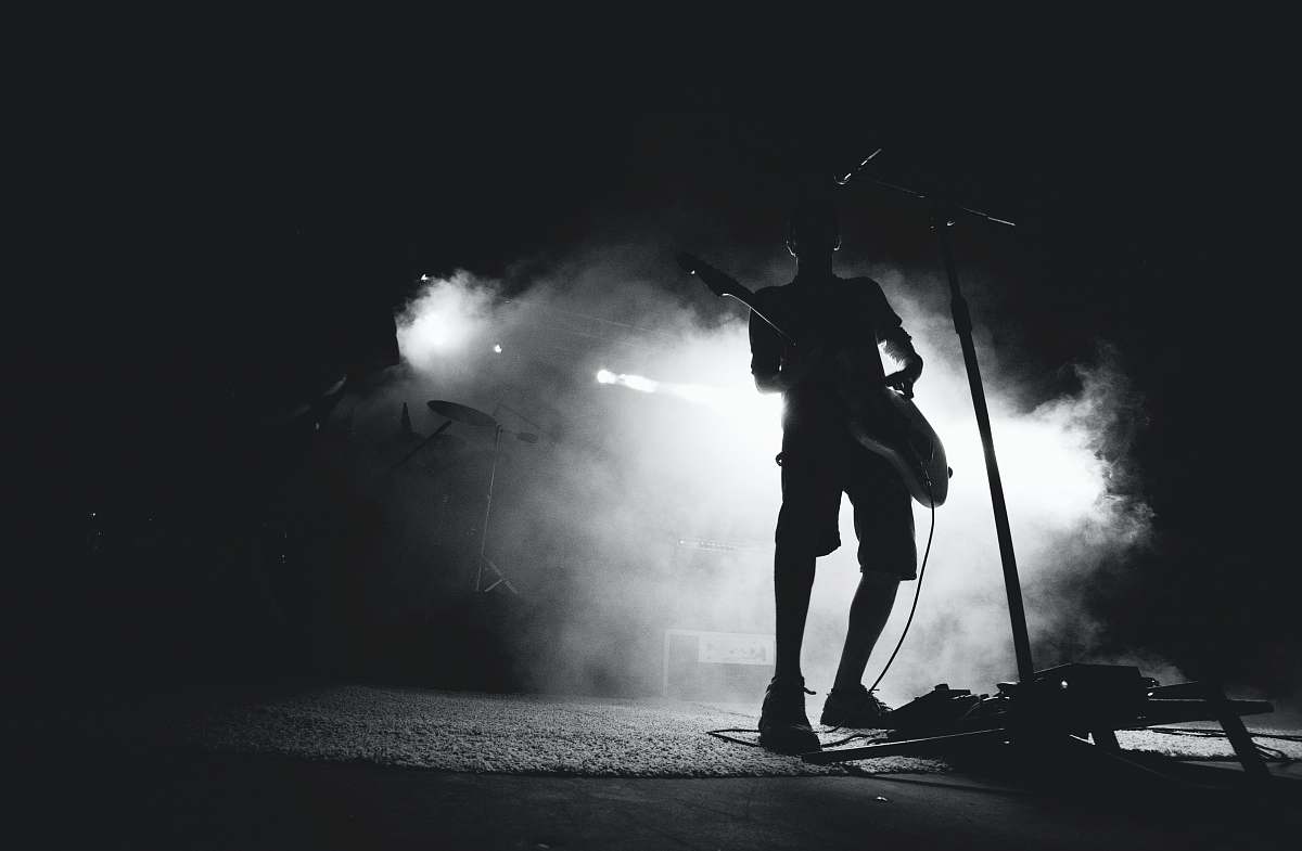 human silhouette photo of guitarist black-and-white