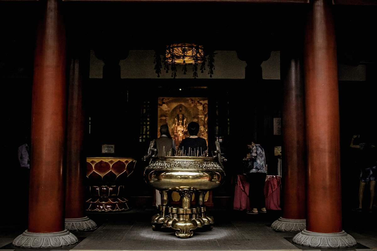 human temple with post and altar people