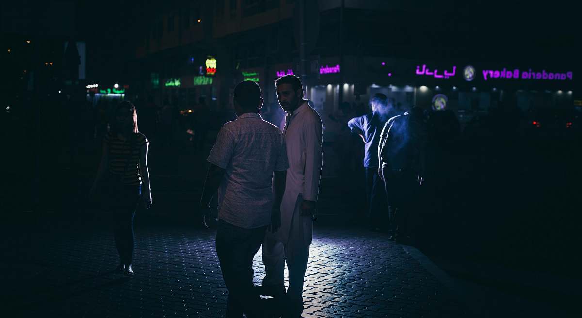 human two men standing on concrete surface people
