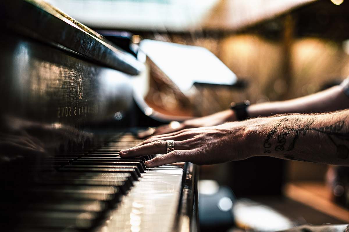 music person playing piano grand piano