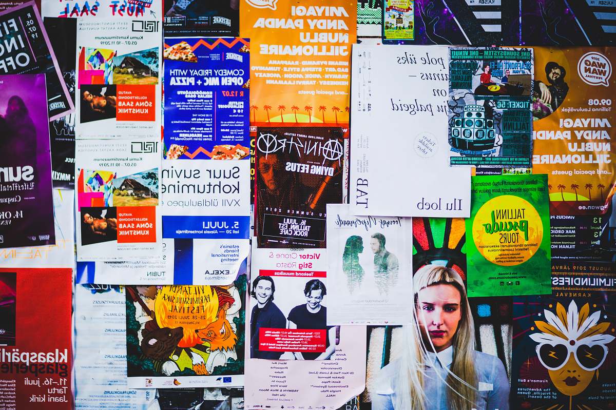 Experience the energy of urban life with this stunning image featuring a wall covered in a variety of colorful posters and brochures. Perfect for marketing professionals, designers, or anyone looking to evoke creativity in their projects, this scene captures the essence of advertisement culture. Use this image to enhance your blog, social media, or promotional materials, showcasing the dynamic world of visual marketing.