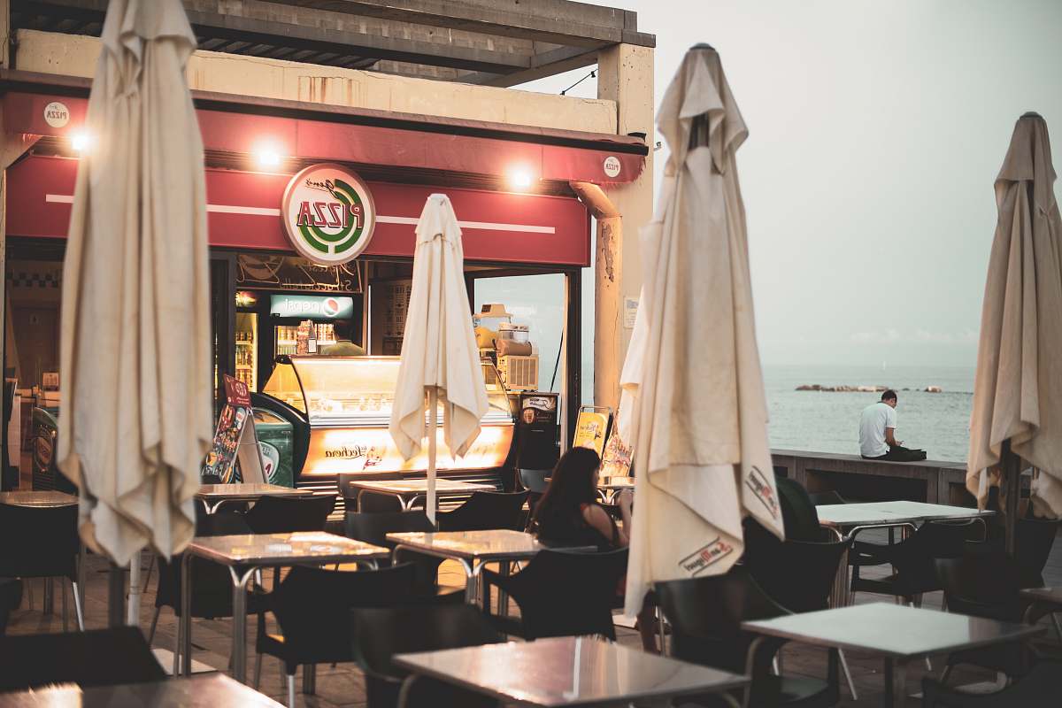 barcelona white dining tables near food establishment restaurant