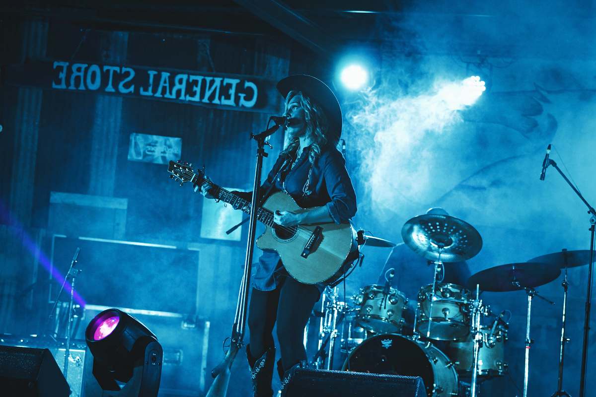 concert woman performing on stage woman