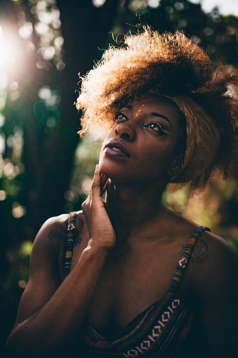  woman in tribal print tank top near trees 