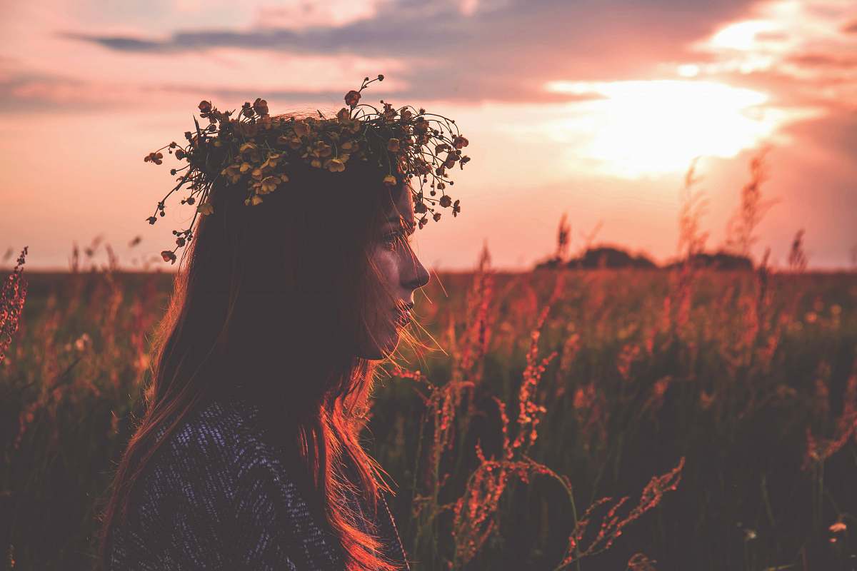 people depth photography of woman with flower headpiece person