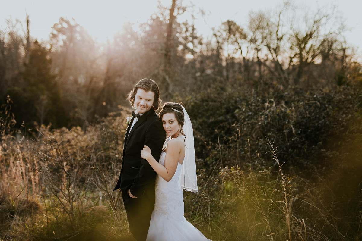person bride and groom near green leafed plants during daytime wedding