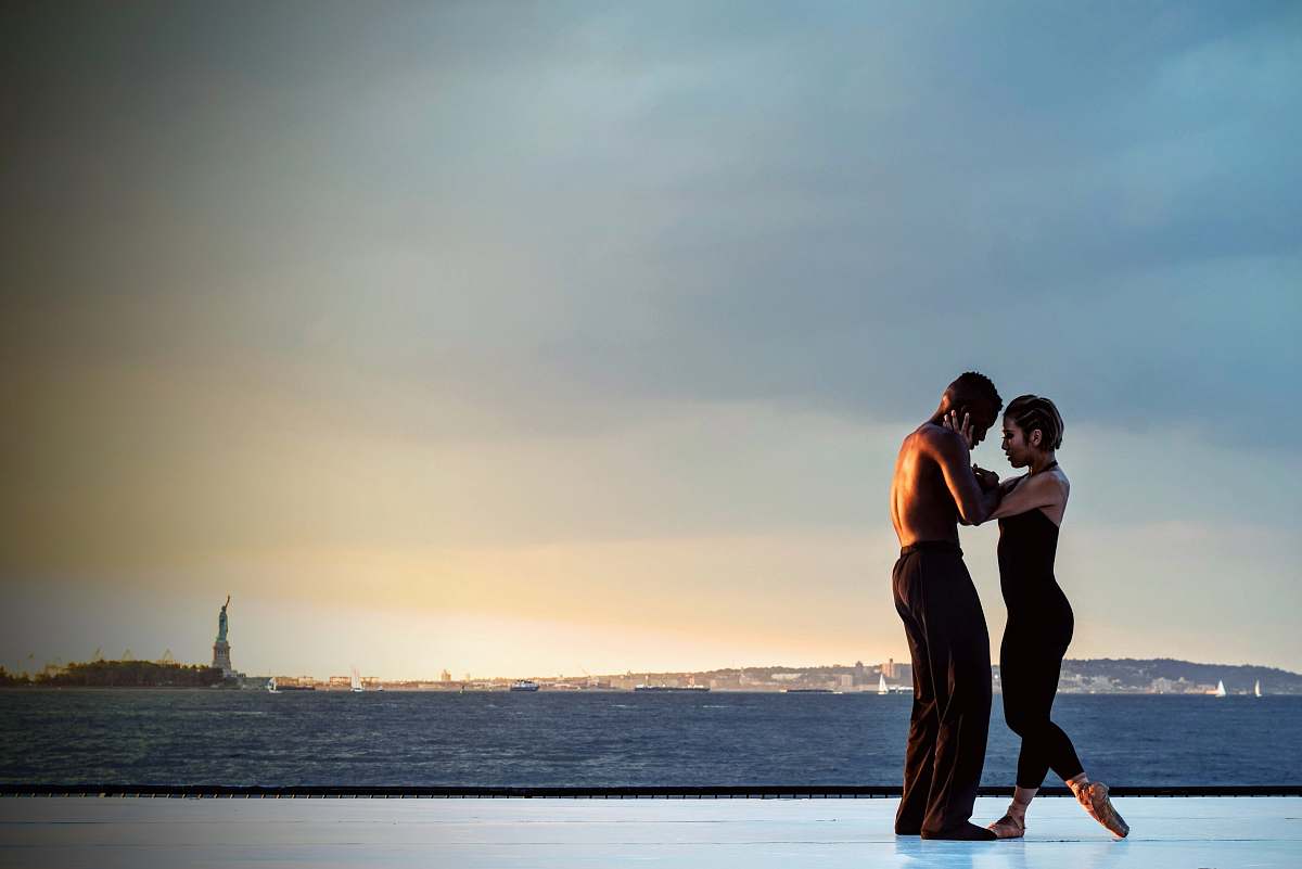 dance couple standing near body of water during daytime new york