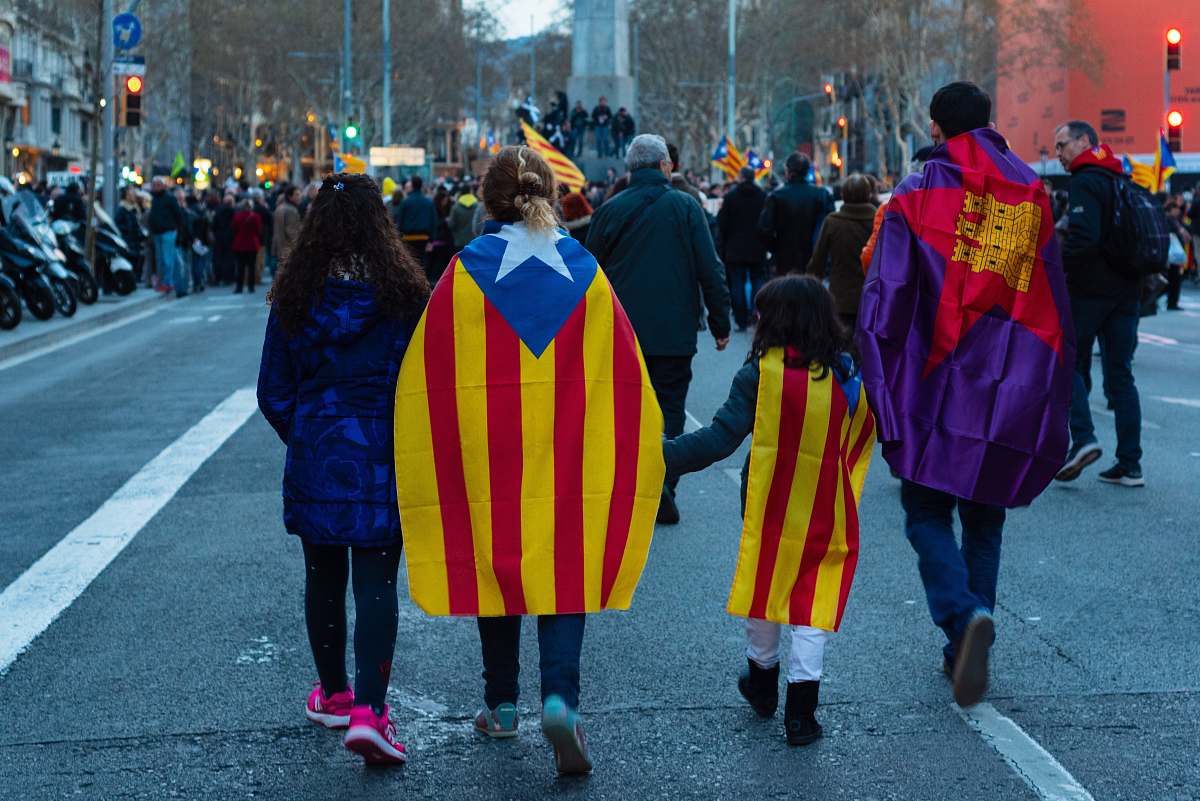 person four person walking on road with flag capes human