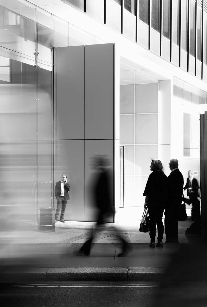 human grayscale photo of people walking towards building black-and-white