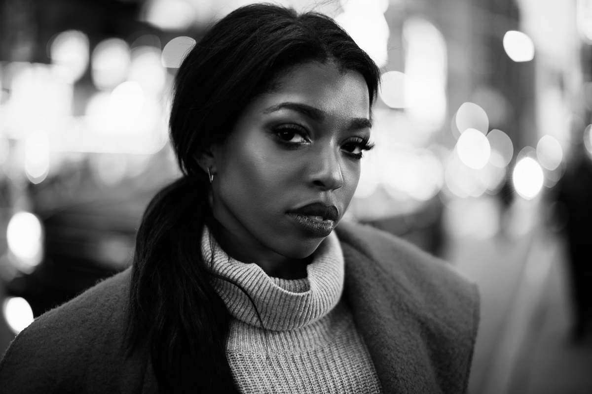 woman grayscale photo of woman wearigng coat black-and-white