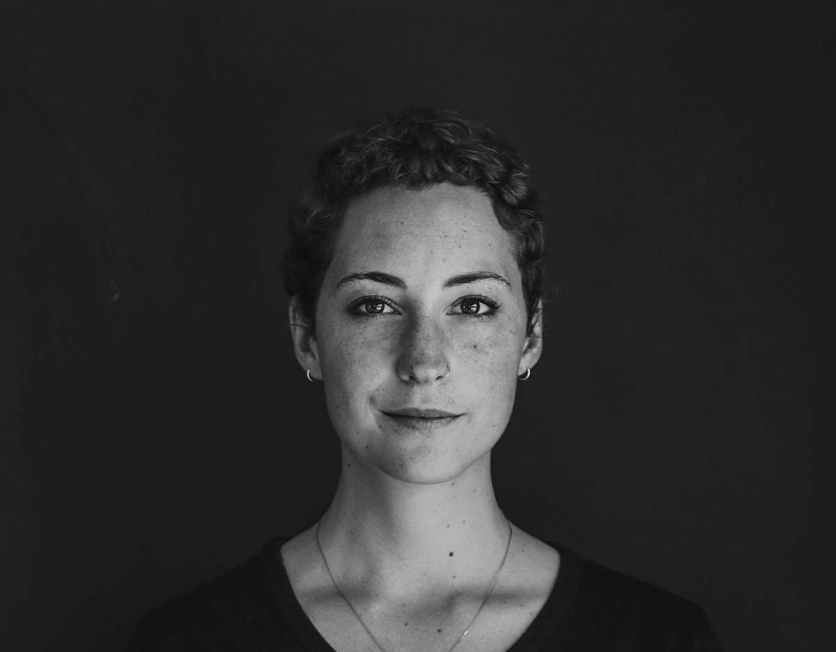 black-and-white grayscale photo of woman wearing necklace and top portrait