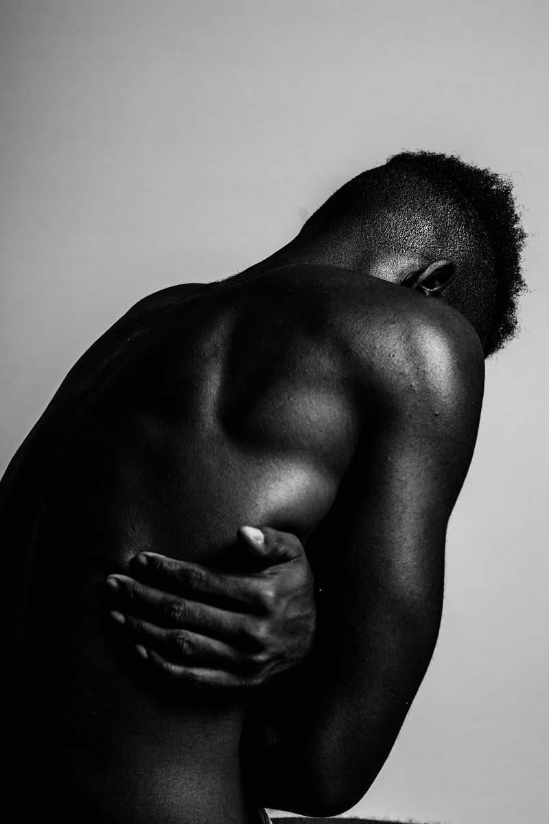 person greyscale photo of naked man black-and-white