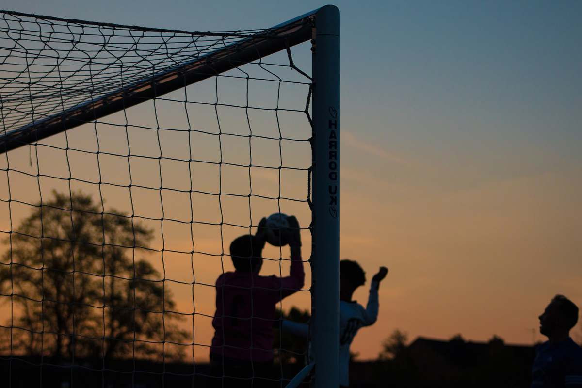 human group of men playing soccer person